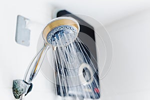 running water of shower faucet with electric water heater