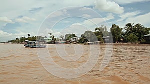 Running waves of the Vietnamese river. Shooting in motion. View from the boat