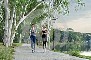 Running woman. Female Runner Jogging during Outdoor Workout in a Park. Healthy lifestyle. Morning