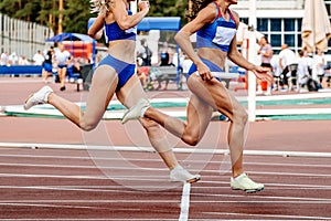 running women track and field team relay race 4 100 metres