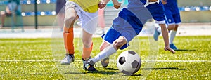 Running Young Soccer Football Players. Youth Soccer Competition Between Two Footballers photo