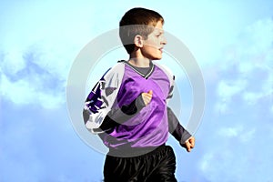 Running youth soccer player