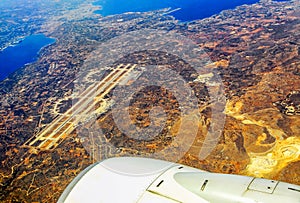 Runway at airport in city Chania from airplane. Crete island - Greece