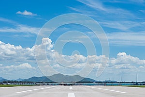 Runway for plane landing or takeoff in blue sky