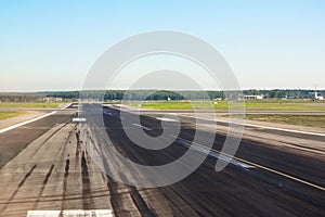 Runway with traces of rubber wheels of the aircraft free for takeoffs and landings at the airport