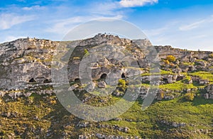 Rupestrian house and church, historic building. Sassi of Matera. Basilicata under blue sky