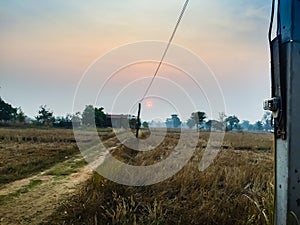 The Rural Area in the Morning with sunrise background and foreground with electric cables. This is for the electricity and