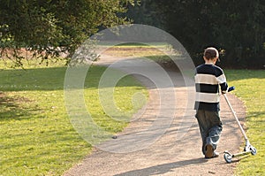 Rural Boy With Scooter