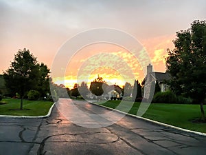 Rural brick lodges in the forest and orange sunset background