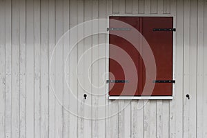 Rural building exterior - wooden shutters on wooden wall