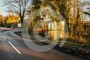 A rural bus stop in the winter sun at Tongland Bridge, Kirkcudbright, Scotland