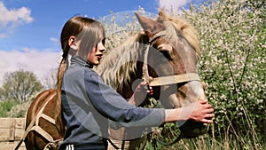 Rural child with a favorite pet horse.