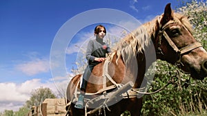 Rural child with a favorite pet horse.