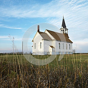 Rural church in field.