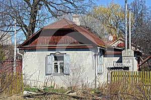 Rural cottage with white wall and wooden shutters