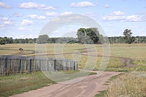 Rural country roads, fence along dirt road, July 2021