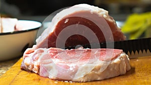 Rural cuisine. Cooking pork in a home country kitchen.