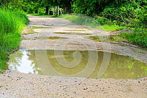 Rural dirt roads are flooded during the rainy season