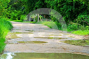 Rural dirt roads are flooded during the rainy season