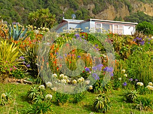 Rural dream house in lush flowering natural garden