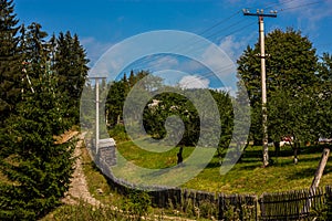 Rural fence and road in Carpathian
