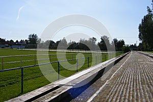 Rural football, soccer pitch taken from the grandstand on a sunny spring, summers day.