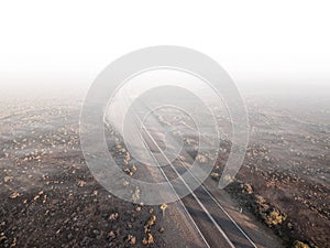 Rural highway passing through desert.