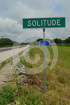 Rural highway road sign SOLITUDE