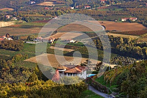 Rural house and autumnal fields in Italy.