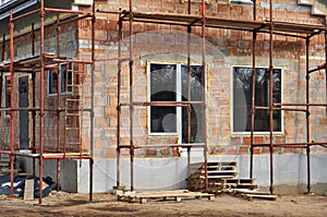 Rural house construction from red brick blocks