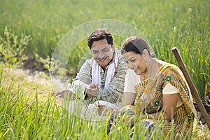 Rural Indian couple in agricultural field