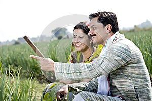 Rural Indian couple in agricultural field