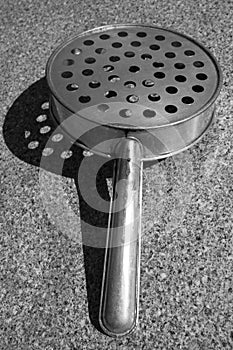 Rural kitchen utensil - strainer on the table.