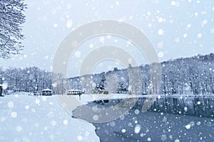 Rural lake in snowfall