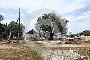 summer rural landscape with an abandoned house