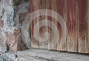 Rural landscape brick pillars near bright grass on the background of trees