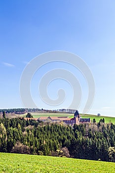 Rural landscape with church of divine word missionaries photo