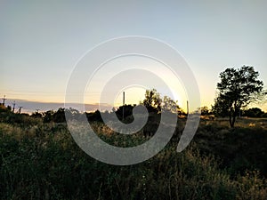 Rural landscape with church at sunset