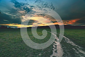 Rural landscape with a curved road photo