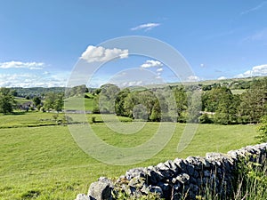 Rural landscape, with fields, trees, and distant hills near, Grassington, Yorkshire, UK