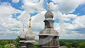 Rural landscape flying around the old wooden church.