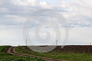 Rural landscape with green fields, soil texture and slops photo