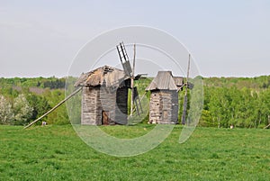 Rural landscape with a mill. Folk architecture and everyday life of Ukraine. Mill. Windmill. Ukraine. Kiev.