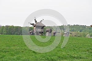 Rural landscape with a mill. Folk architecture and everyday life of Ukraine. Mill. Windmill. Ukraine. Kiev.