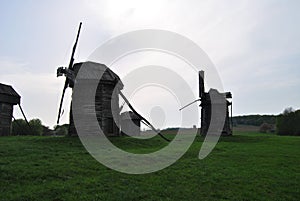 Rural landscape with a mill. Folk architecture and everyday life of Ukraine. Mill. Windmill. Ukraine. Kiev.