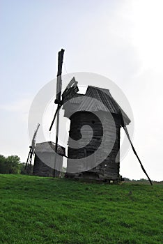 Rural landscape with a mill. Folk architecture and everyday life of Ukraine. Mill. Windmill. Ukraine. Kiev.