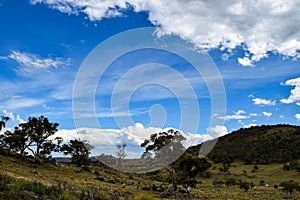 Rural landscape with mountains and overcast blue sky