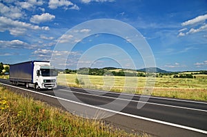 Rural landscape with road you are driving a white truck