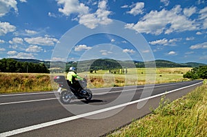 Rural landscape with road you are riding a motorcycle