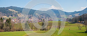 Rural landscape Schliersee area with view to spa town and green pasture, bavaria